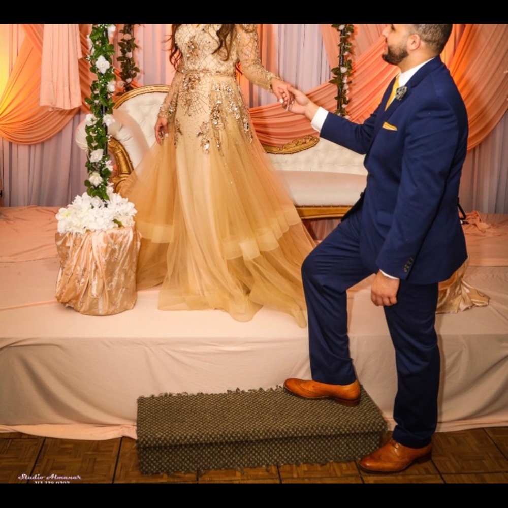 Beautiful long sleeve gold gown for sale.